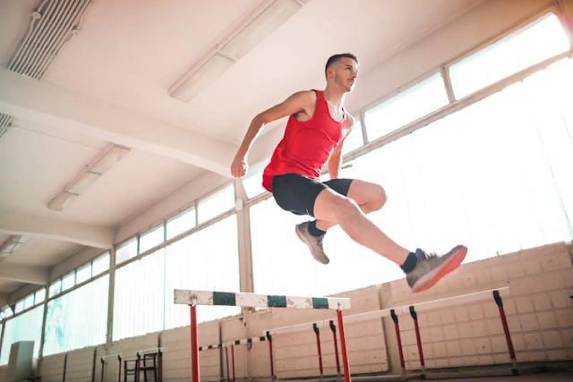 Person jumping over an obstacle.