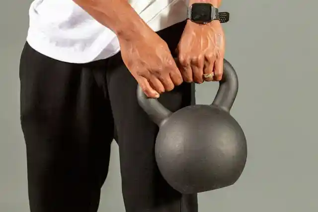 Person holding a kettle